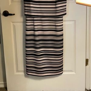 This is a New York & Company Stretch dress in a size L. It is black & beige.